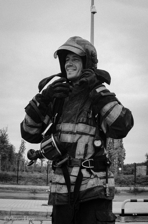 Happy firefighter in turn out gear.