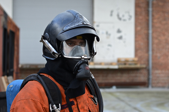 Firefighter with SCBA & helmet.